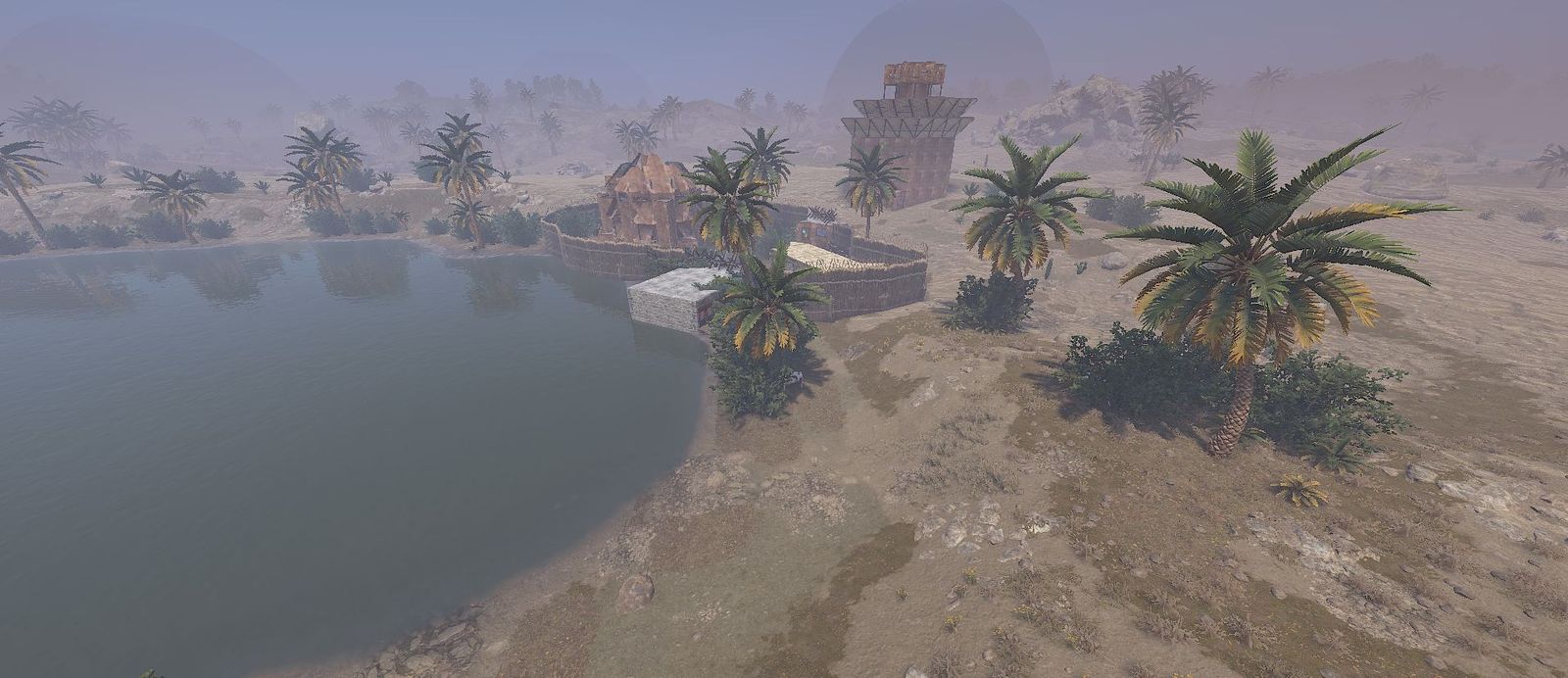 A walled desert base beside an oasis, with the dark dome of a 2x PvP zone on the horizon